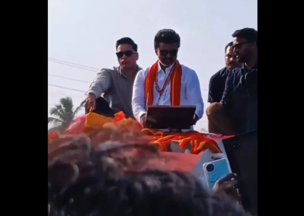 Actor-turned-politician Vijay receives a wedding photo from a fan during his Tamil Nadu political tour, as the image goes viral amid ongoing divorce rumours.